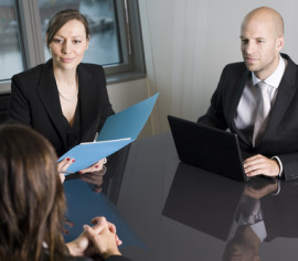 Two credit counseling attorneys in White Plains talking to a client.