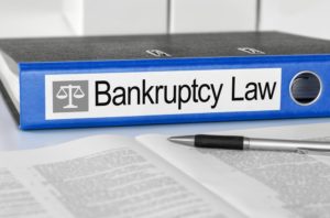 Blue folder labelled bankruptcy law.