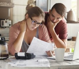 Young couple having debt problems on how to pay their loans.