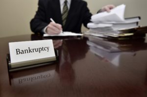 Mount Vernon Bankruptcy lawyer doing paperwork for client in New York.